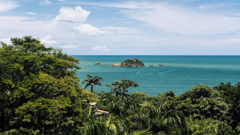 Turquoise Pacific ocean, offshore island, and lush tropical greenery at Manuel Antonio, Costa Rica
