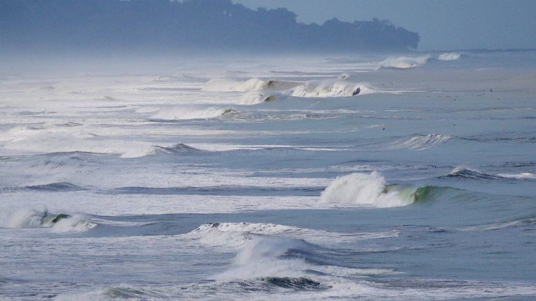 Breaking waves at Playa Hermosa in Garabito, Costa Rica
